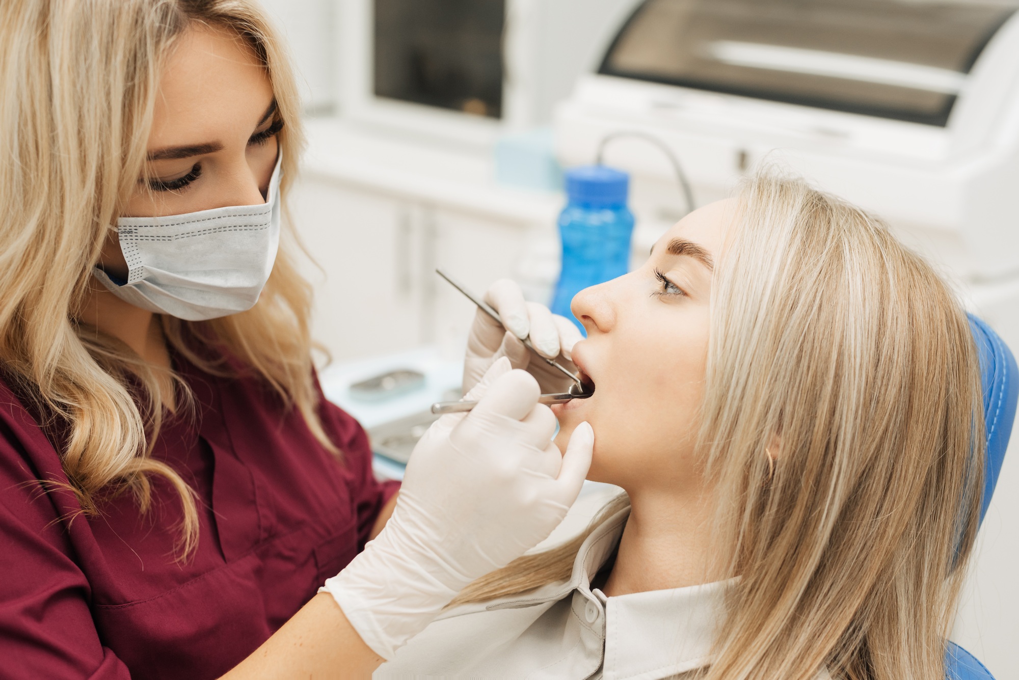 Dentist examining a patient's teeth in the dentist.